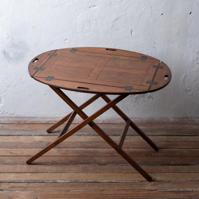 A Georgian mahogany butler’s tray on stand, circa 1800. 29 ½ inches wide by 20 ¼ inches deep by 30 inches tall measured...