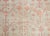 A beautiful early 20th century Central Asian Khotan rug with an all-over pomegranate pattern woven in muted crimson set...