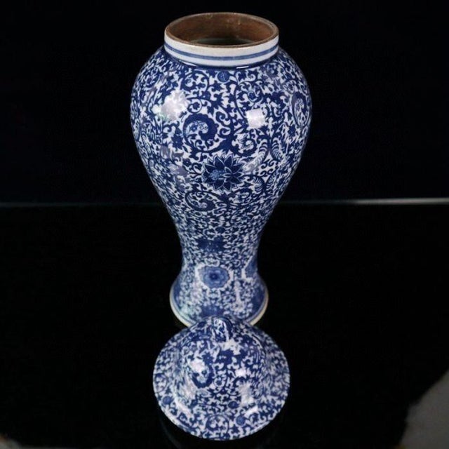 Stately tall Chinese Ginger Jar with domed matching lid. The entire surface is densely decorated with classic interlocking...