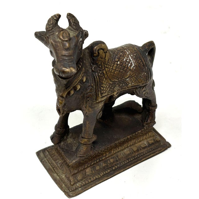 Vintage Patinated Hindu Bronze "Nandi Bull" Sculpture, circa 1950s. An Indian vintage Nandi bull sculpture from the mid...