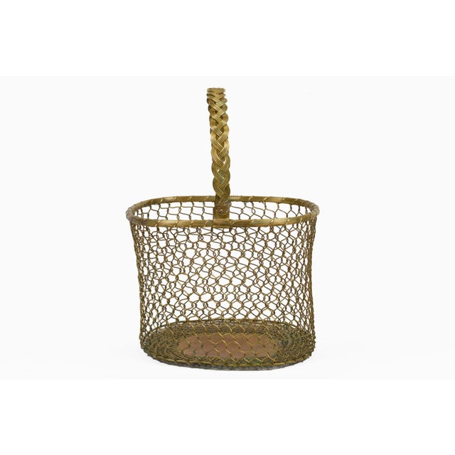 A charming vintage oval loop chainlink woven brass wire mesh basket with an adjustable brass braided handle. Great used as...