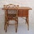 A woven rattan desk and its original chair. Characteristic of Louis Sognot's work, this set combines functionality, clean...