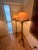 Pair of Dennis & Leen roped iron floor lamps with large bobeche and waxed candle holds one 3-way socket. The finish is...