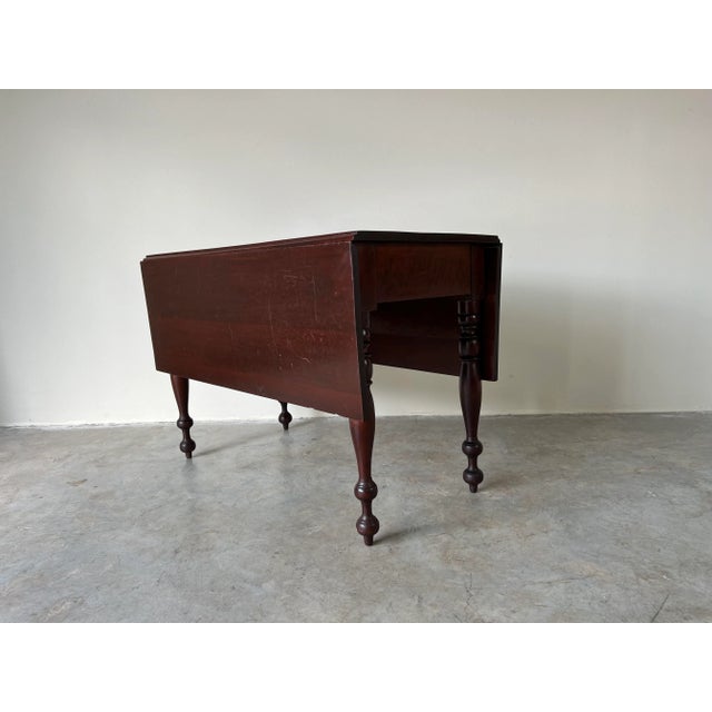 Beautiful Antique 19th Century Walnut drop leaf American dining breakfast Table with wonderful detailed turned legs. Both...