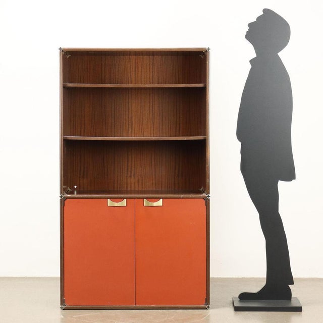 Modular cabinet, with hinged doors and open shelves, mahogany veneered wood, Formica doors, brass-plated aluminum handles....