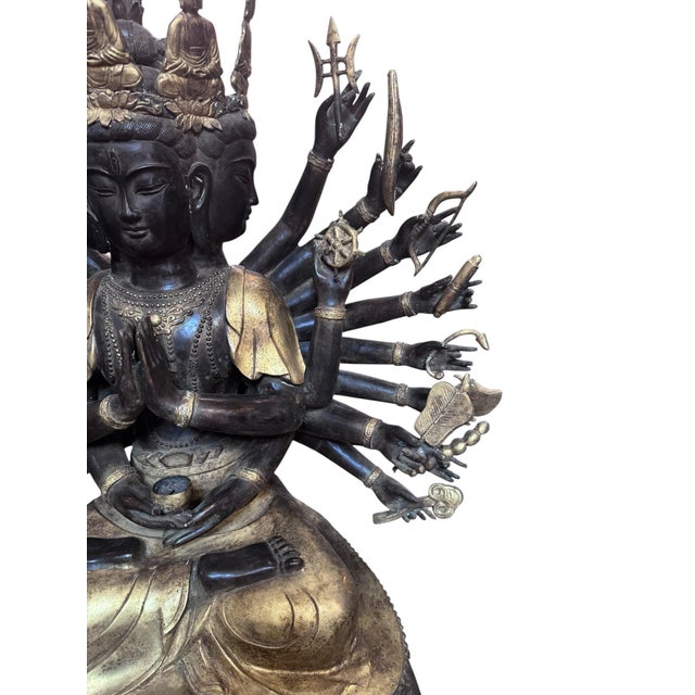 Antique Tibetan Praying Crowned Buddha This buddha sits in a seating lotus position a triangular base. His many hands fan...