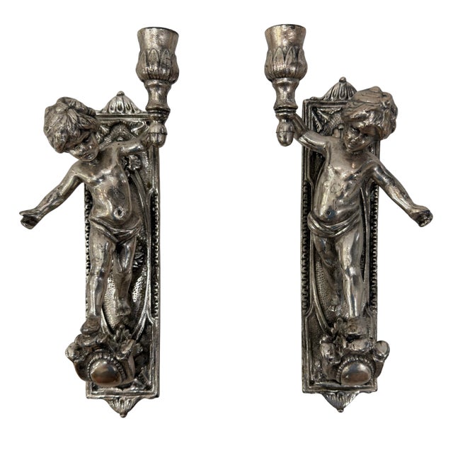 Renaissance-style Italian cherubim wall sconces! Made in Italy by Jennini (marked in base). Metallic material with aged...