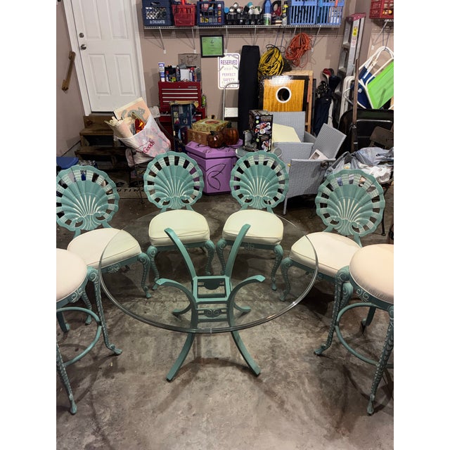 Beautiful Veneman vintage clamshell cast aluminum table and chairs set with powder coating. All original. Includes a...