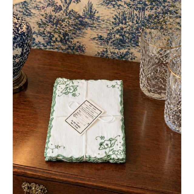 New old stock vintage cocktail napkins crafted from 100% linen with delicate hand embroidery and scalloped green edges,...