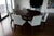 Custom-made round extendable dining table from a gallery, paired with 12 Christian Liaigre for Holly Hunt leather dining...