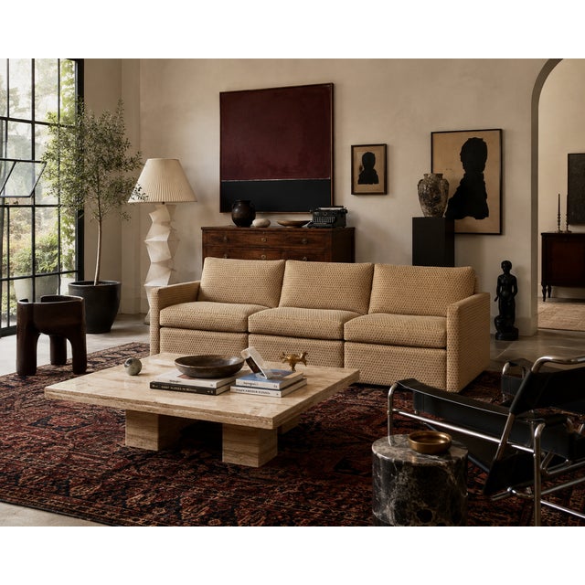 A three-seat vintage sofa with clean, boxy lines and a tailored, tight profile- a hallmark of Pfister’s minimalist,...