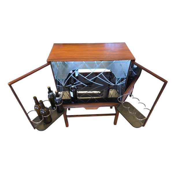 A very beautiful and well-equipped bar cabinet in Santos Rosewood with an exclusive interior and unusually compact...