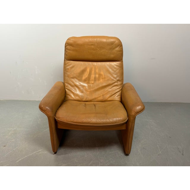 Mid-Century Design De Sede Cognac Leather Lounge Chair Model DS-50, Switzerland 1970s. A Swiss mid‑century lounge chair...
