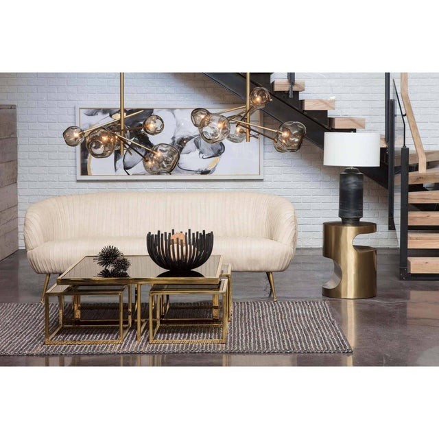 With seamless interplay of sculptural curves and crisp lines, our Nathan side table makes a dramatic style statement. Wipe...