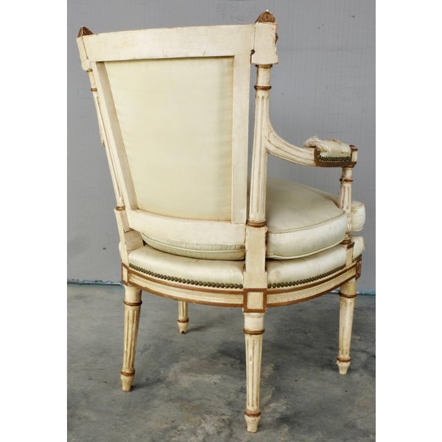 This is a stunning hand-painted cream and gold painted 19th century Sheraton armchair. Aged satin covers the seat and...