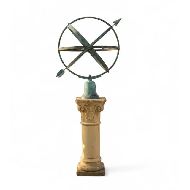 This impressive and highly decorative piece features a large bronze armillary sphere atop a classically carved stone...