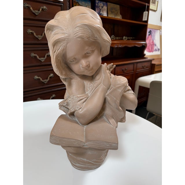Design Plus Gallery presents a Sculpture of a Young Girl Reading a Book by Pablo Verde. The vintage is a large plaster...