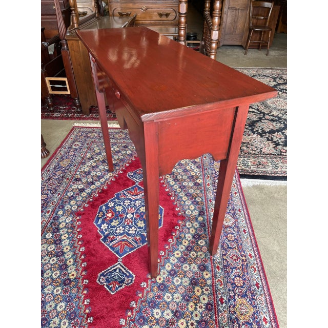 Very nice farmhouse style huntboard by Eddy West. Made out of pine with a red distressed finish. Features two dovetailed...