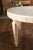 An Italian vintage neoclassical style pine dining room table from the mid-20th century, with white marble top, carved...