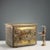 A firewood storage chest made of iron covered with gilded, embossed, and burin-worked sheet metal. Decorated with...