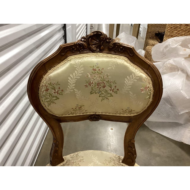 Pretty pair of French boudoir chairs. These small chairs were traditionally in a bedroom. The silk brocade upholstery is...