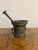 Quality antique bronze pestle and mortar, having a quality antique bronze pestle and mortar the mortar with raised...