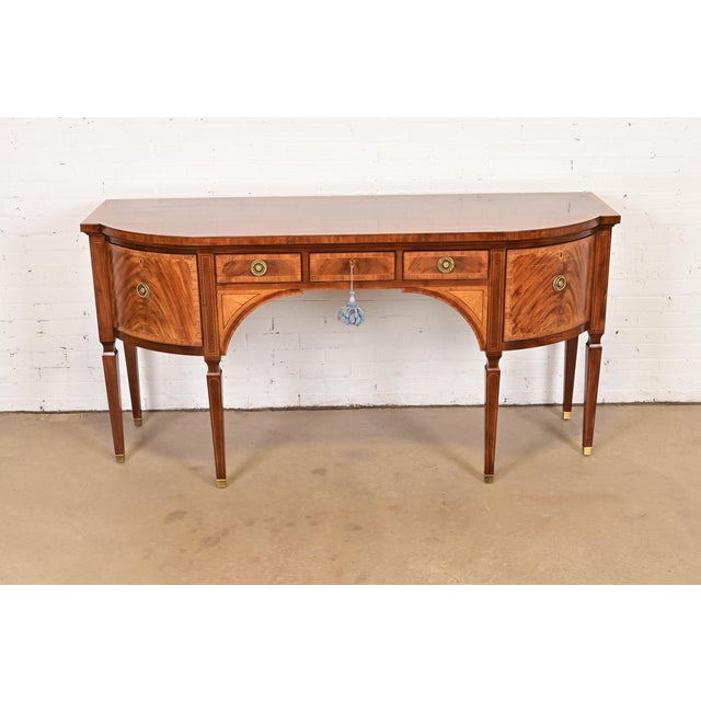 A rare and exceptional Sheraton or Hepplewhite style bow front sideboard or credenza From the exclusive Stately Homes...