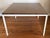 Classic Florence Knoll-designed T Angle Side Table, Model 304 Square top with walnut laminate, white powder-coated base....