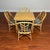 McGuire vintage dining set consisting of a blonde color square table and four matching chairs. The rattan side chairs were...