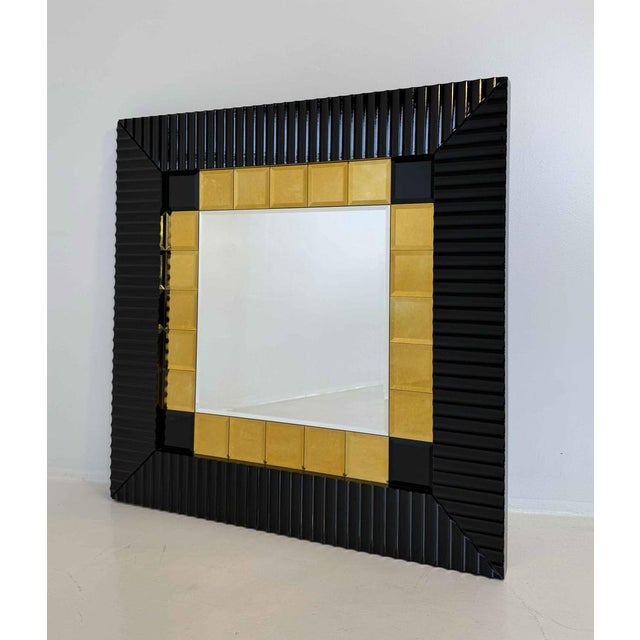 Striking wall mirror produced in Italy during the 1980s, defined by its bold architectural frame and strong geometric...