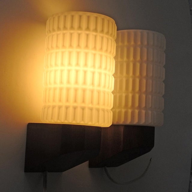 Satin opal white glass with molded design, cylindrical shape. African hardwood base with beveled edges. annecy model (see...