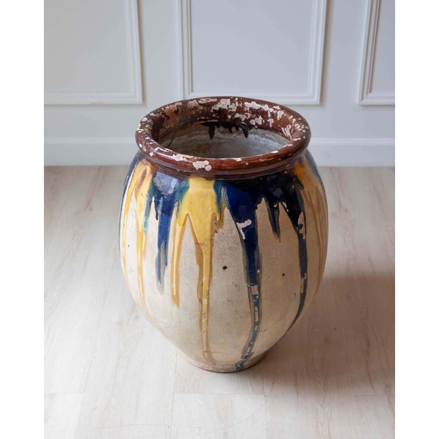 This terracotta dribble pot is French and dates to around 1840. The name refers to the glaze, which was applied to the...