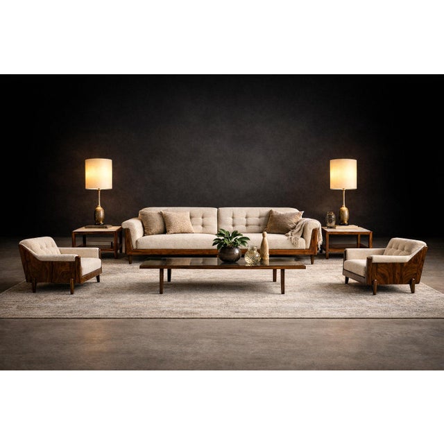 A disciplined study in volume and material contrast, this pair of Brazilian Modern armchairs attributed to Bertomeu...