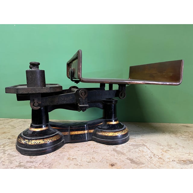 French bench scale from the 1950s Cast iron with a square copper plate and two weights Original, intact, and one-of-a-kind...