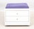 Contemporary White Laminate Storage Ottoman, with purple suede upholstered cushion above two drawers with divided...