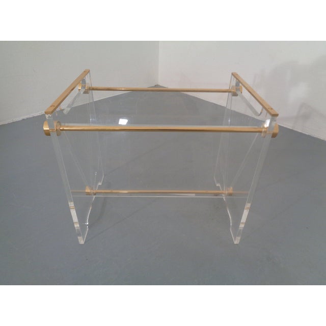 French newspaper stand in acrylic glass and brass by David Lange for Marais International from the 1970s. I have official...