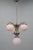 A refined art deco chandelier produced in czechoslovakia in the 1930s, showcasing a nickel-plated metal structure with...
