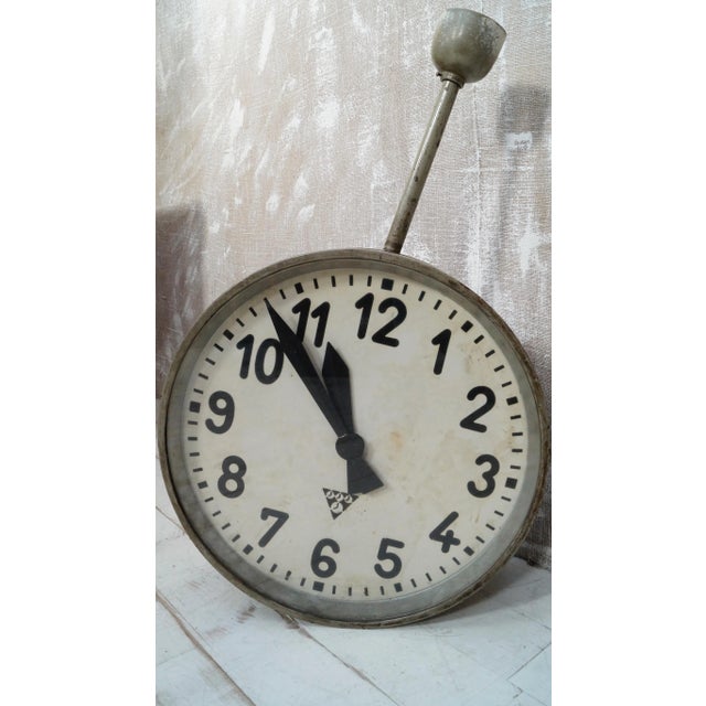 A superb vintage pragotron steel industrial double-sided clock. In metal, original grey paint. This piece is in great...