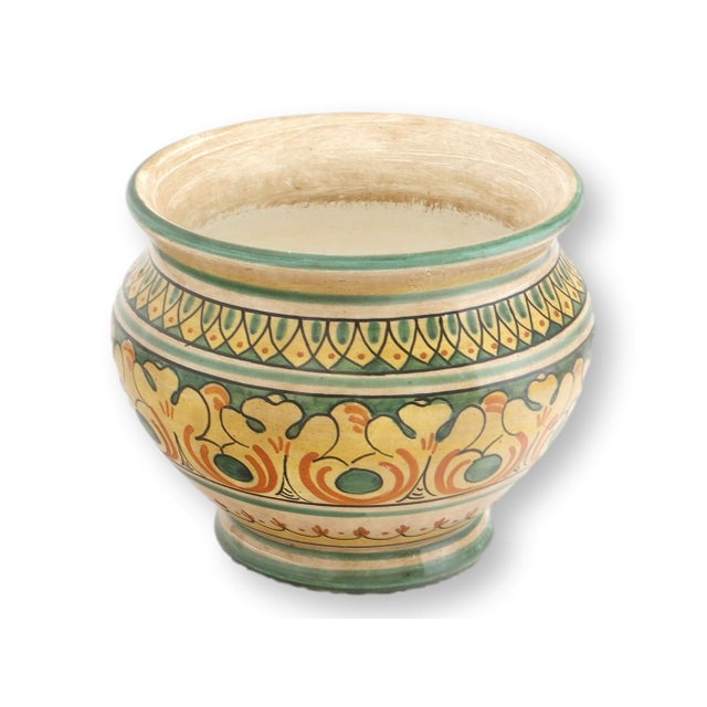 Mid 20th century Italian faience footed cache pot with hand-painted scrolling decoration in earthy ochre, green, and...