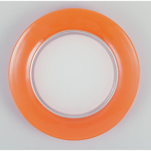 Duralex, France. A set of four art glass plates in orange and white glass. 1970s. In excellent condition with minimal...