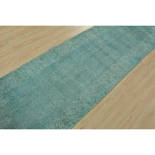 An authentic vintage traditional overdyed Tabriz rug hand-knotted with fine wool on a cotton foundation. This rug features...