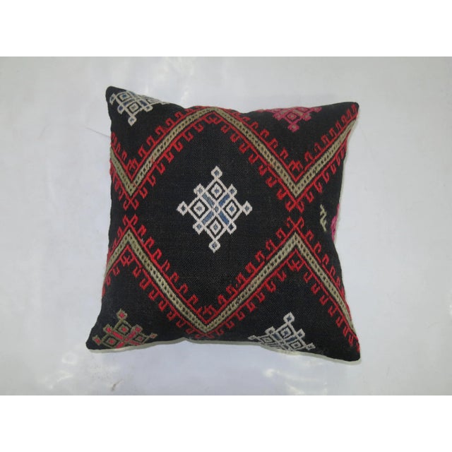Pillow made from a 20th century Jajim textile with cotton back. Zipper closure and foam insert provided.
