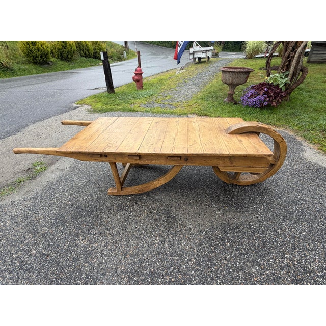 For sale in Sunapee Harbor is old antique wheelbarrow converted to a coffee table. This unique piece came from an estate...