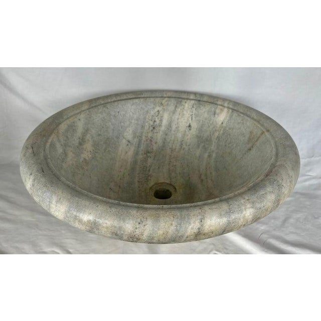 Mid 20th century classic Roman style Italian made limestone sink. There are soft shades of cream, gray, golds, and more. A...