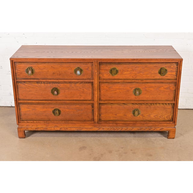 A gorgeous mid-century modern Hollywood Regency Chinoiserie style six-drawer dresser or credenza By Davis Cabinet Company...