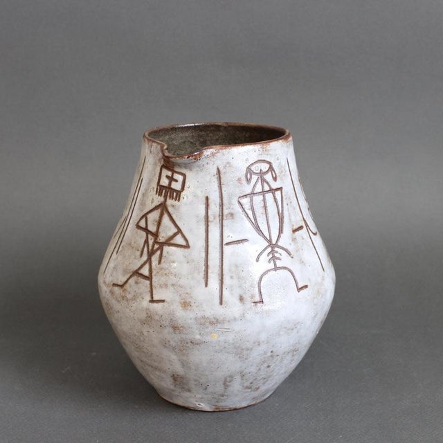 Mid-century ceramic pitcher / vase by alexandre kostanda (circa 1960s). This beautiful vessel presents a creamy, glazed...