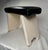 This stool is a small, low, handmade wooden and painted piece with a simple rustic construction. The legs and frame are...