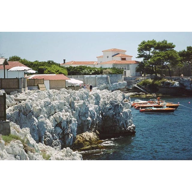 Boats At Hotel Du Cap Eden Roc 1969 by Slim Aarons Slim Aarons Limited Estate Edition Motorboats moored off the Hotel du...