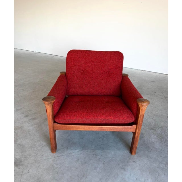 Renowned designer Arne Vodder for Cado, this classic and timeless design was built to last. Chair features a solid teak...