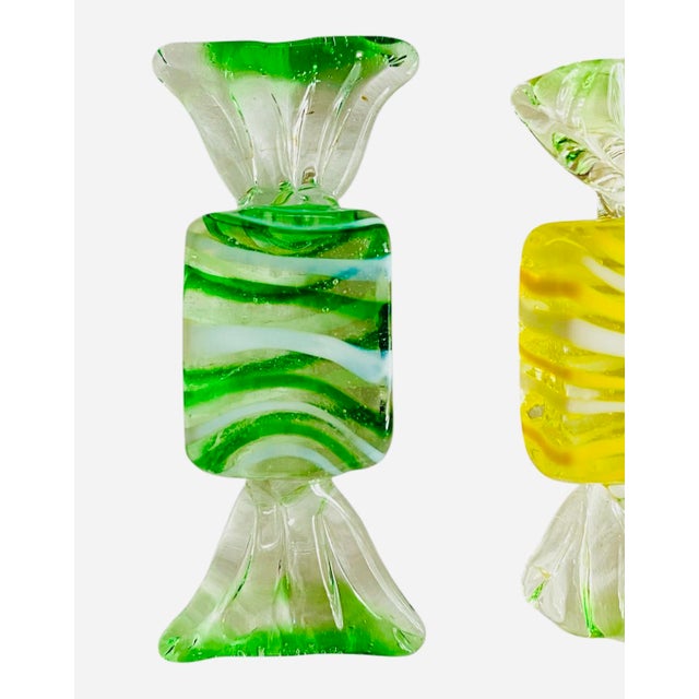 Set of 3 Handblown Murano glass wrapped striped candies. Two green and one yellow. Mint condition. Dimensions are...